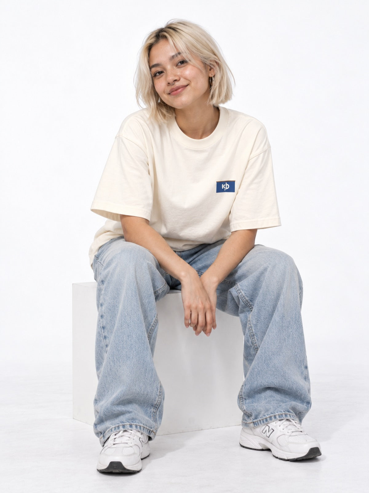 Sento 銭湯 Japanese Bathhouse T-Shirt in vintage white by 5C5V, on model, seated