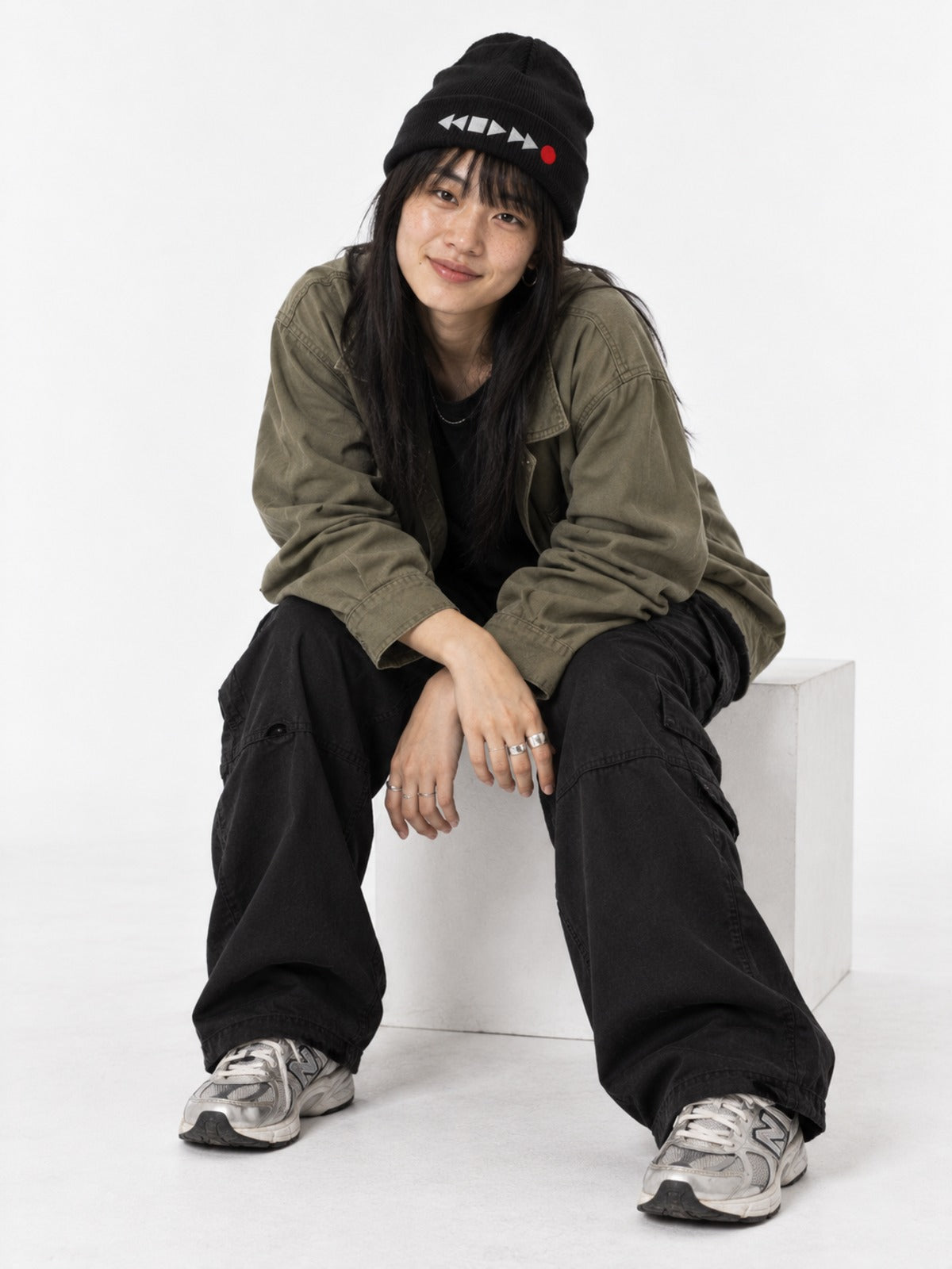 Tape Deck Japanese Beanie in Black by 5C5V, on model, seated