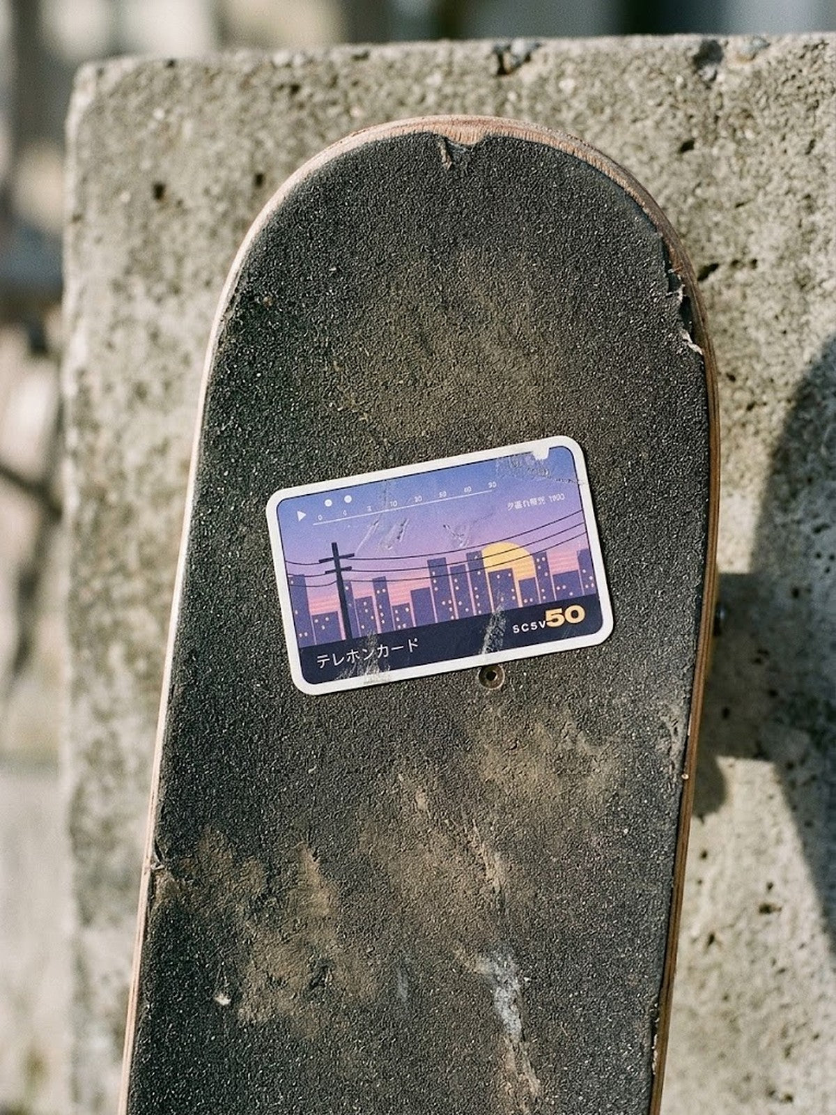 Terehon Kādo テレホンカード Japanese Phone Card Sticker by 5C5V on a worn skateboard deck