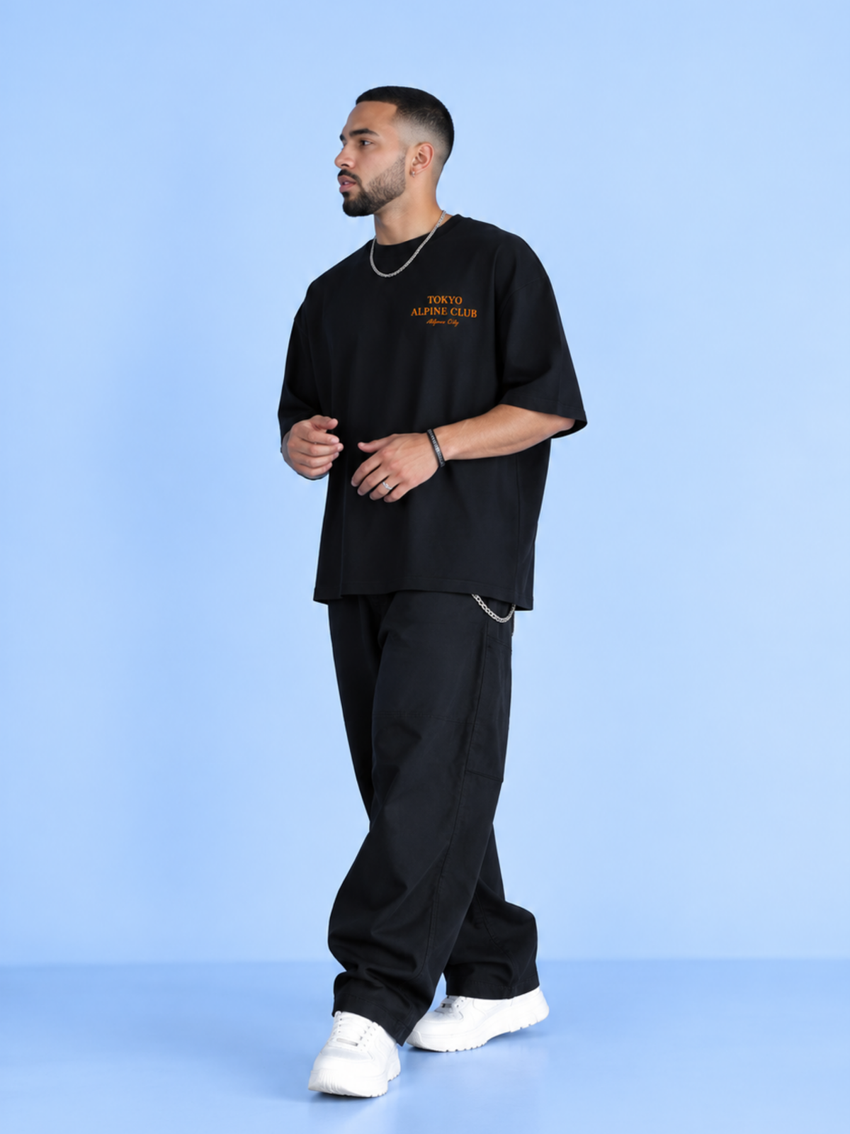 Full-length shot of a model in the black Tokyo Alpine Club tee
