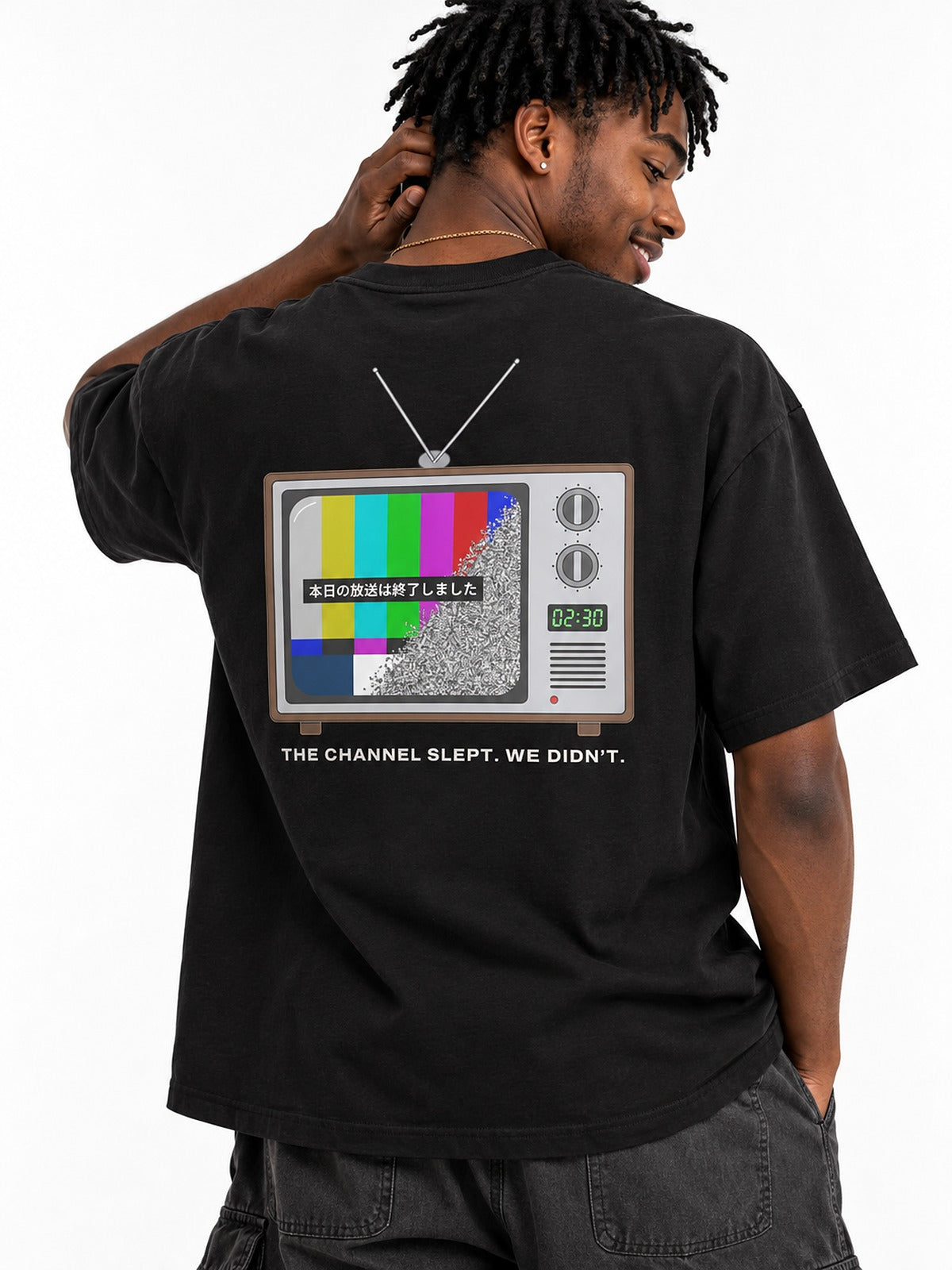 Sunaarashi 砂嵐 T-shirt by 5C5V, close-up of the TV back print, THE CHANNEL SLEPT. WE DIDN'T.